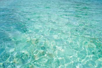 Crystal clear blue water in tropical lagoon for texture or background