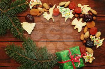 Christmas background with gingerbread cookies with nuts and fruits