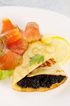 ruddy flapjack with caviar and smoked salmon