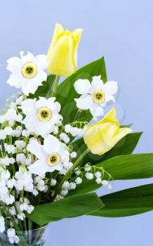 Spring bouquet of tulips, daffodils and lilies of the valley