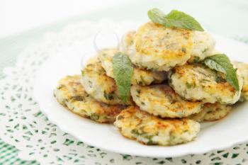 Fried pancakes with fresh herbs and mint