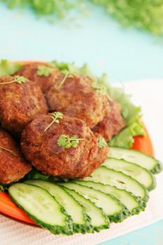 Fried cutlets with cucumber and watercress salad