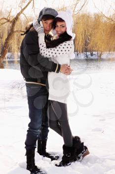 Young beautiful couple on nature in winter
