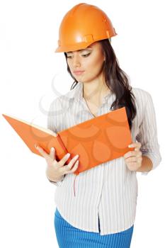 The woman in the construction helmet with a notebook in hand