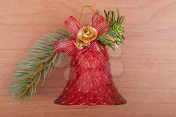 Christmas decoration bell on a wooden background.