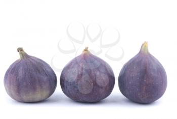 Three figs on a white background.