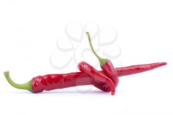 Two pods of chili peppers on a white background.