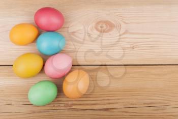 Easter eggs on wooden background.