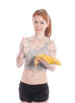 Athletic girl with bananas in hand on white background.