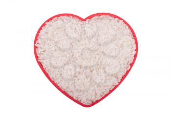 Rice in a plate in the form of heart on a white background.