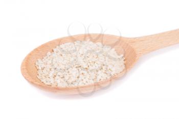 Sesame seeds in a spoon isolated on white background.