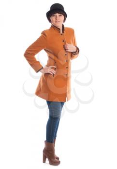 Portrait of a girl dressed in orange coat in studio.
