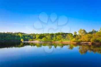 Summer Landscape With River And Blue Sky.