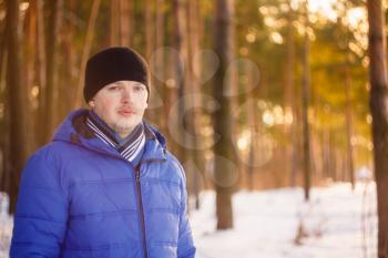 Portrait Of Young Cheerful Man Outdoor In Winter Forest
