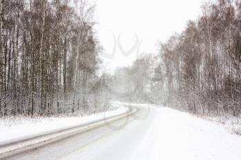 Snowy Land Road At Winter. Adverse Weather Conditions