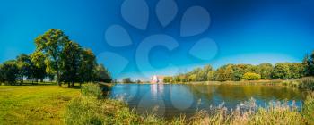 Mir, Belarus. Panoramic View Of Mir Castle Complex From Side Of Lake. Architectural Ensemble Of Feudalism, Ancient Cultural Monument, Famous Landmark In Summer Sunny Day Under Blue Sky, Copyspace.