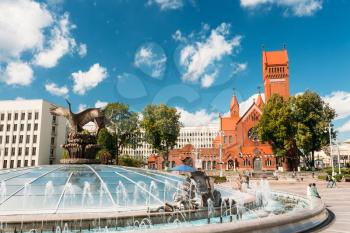 Church Of Saints Simon And Helen (Red Church) And Fountain At Independence Square In Minsk, Belarus