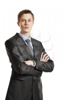 Young handsome businessman in black suit and tie isolated on white background