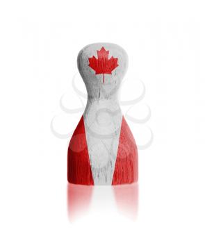 Wooden pawn with a painting of a flag, Canada
