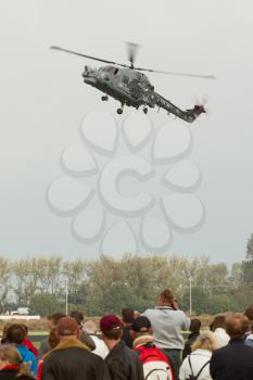 LEEUWARDEN,FRIESLAND,HOLLAND-SEPTEMBER 17: Royal Navy Helicopter Display Team 'Black Cats' at the at the“Luchtmachtdagen” Airshow on September 17, 2011 at Leeuwarden Airfield,Friesland,Holland