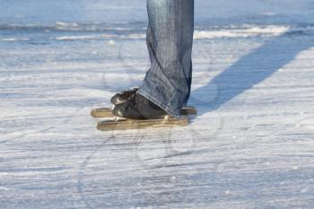 A ice skater is skating on the famous dutch Bonkevaart Friese Elfstedentocht