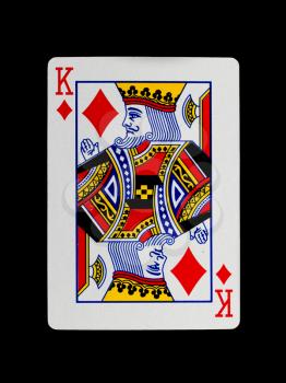 Old playing card (king) isolated on a black background