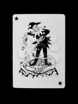 Old playing card (joker) isolated on a black background