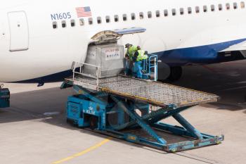 AMSTERDAM - MAY 11: Boeing 767-332ER of Delta is being loaded by ground personal before taking off from Schiphol airport located in Amsterdam, on May 11, 2012, Amsterdam, The Netherlands.