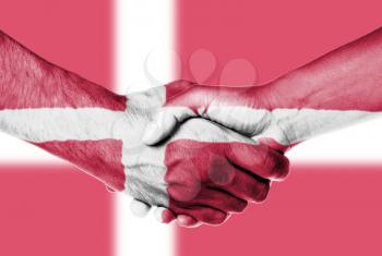 Man and woman shaking hands, wrapped in flag pattern, Danmark