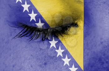 Crying woman, pain and grief concept, flag of Bosnia and Herzegovina
