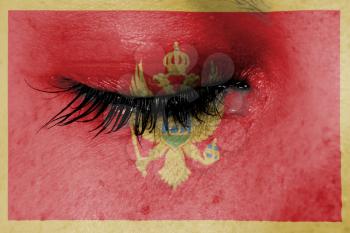 Crying woman, pain and grief concept, flag of Montenegro