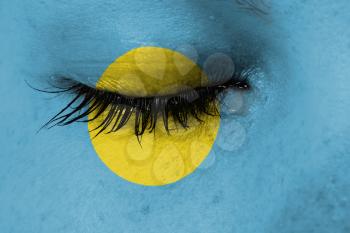 Crying woman, pain and grief concept, flag of Palau