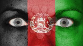 Close up of eyes. Painted face with flag of Afghanistan