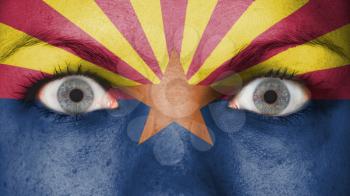 Close up of eyes. Painted face with flag of Arizona