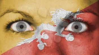 Close up of eyes. Painted face with flag of Bhutan