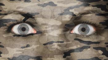 Close up of eyes. Painted face with camouflage