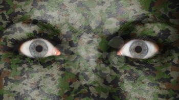 Close up of eyes. Painted face with camouflage