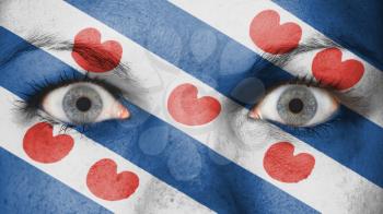 Close up of eyes. Painted face with flag of Friesland