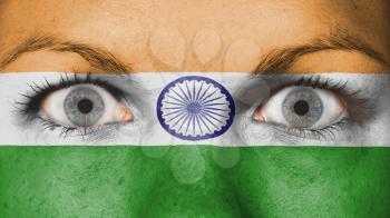 Close up of eyes. Painted face with flag of India