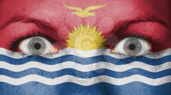 Close up of eyes. Painted face with flag of Kiribati