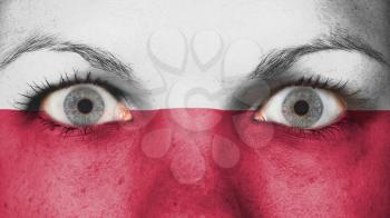 Close up of eyes. Painted face with flag of Poland