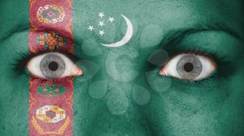 Close up of eyes. Painted face with flag of Turkmenistan