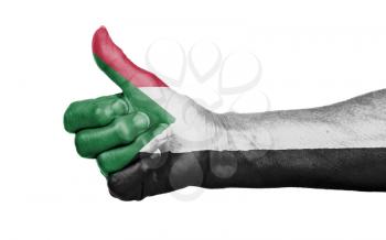 Old woman giving the thumbs up sign, isolated, flag of Sudan