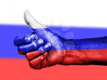 Russian flag on thumbs up hand isolated on a flag background