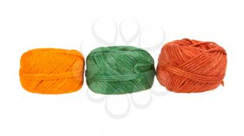 Three colours of knitting yarn isolated on a white background