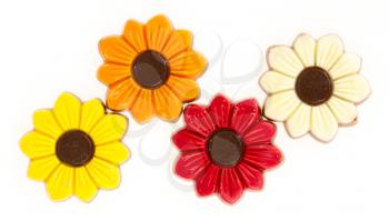 Different colors of chocolate flowers isolated on white