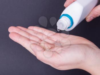 Woman holds a Contact Lens on her hand