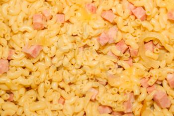 Close-up of macaroni and cheese with onion