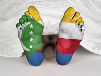 Feet with flag, sleeping or death concept, flag of The Comoros