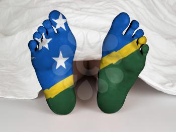 Feet with flag, sleeping or death concept, flag of The Solomon Islands
